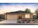 Charming single-story home featuring a 2-car garage, beautiful stone accents, and desert landscaping at 13518 W Copperleaf Ln, Peoria, AZ 85383