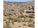 Exterior view of house surrounded by desert landscape at 17929 W Estes Way, Goodyear, AZ 85338