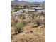 Desert neighborhood featuring a variety of single-Gathering homes, natural landscaping, and winding streets at 17929 W Estes Way, Goodyear, AZ 85338