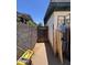 Narrow side yard enclosed by a block fence at 3440 W Bluefield Ave, Phoenix, AZ 85053