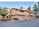 Attractive multi-level townhome with a two-car garage and well-maintained landscaping at 5640 E Bell Rd # 1099, Scottsdale, AZ 85254