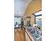 Kitchen area with stainless steel sink, appliances, and view into the dining area at 5640 E Bell Rd # 1099, Scottsdale, AZ 85254