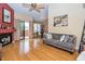 Bright living room with hardwood floors, fireplace, and sliding glass doors to a balcony at 5640 E Bell Rd # 1099, Scottsdale, AZ 85254