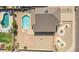 Aerial view of a home with a pool, patio, gravel landscaping, and outdoor seating areas at 7709 W Hearn Rd, Peoria, AZ 85381