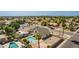 Aerial view shows a backyard featuring a pool, outdoor seating, and gravel landscaping, all enclosed by a fence at 7709 W Hearn Rd, Peoria, AZ 85381