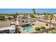 Aerial view of a backyard with a pool, patio, and gravel landscaping, enclosed by a wooden fence at 7709 W Hearn Rd, Peoria, AZ 85381