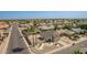 Aerial view showcases a two-story home with desert landscaping, a gravel front yard, and a two-car garage at 7709 W Hearn Rd, Peoria, AZ 85381