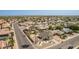 An aerial view captures a neatly landscaped home nestled in a serene neighborhood at 7709 W Hearn Rd, Peoria, AZ 85381