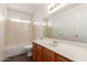 Well-lit bathroom with a large mirror, vanity, and shower-tub combination, perfect for comfort and convenience at 7709 W Hearn Rd, Peoria, AZ 85381