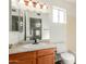 Cozy bathroom featuring a mirrored vanity and a toilet at 7709 W Hearn Rd, Peoria, AZ 85381