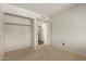 The bedroom offers a functional closet and a door leading to the hallway or other parts of the home at 7709 W Hearn Rd, Peoria, AZ 85381