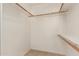 Walk-in closet with built-in shelving and racks, providing ample storage and organization space at 7709 W Hearn Rd, Peoria, AZ 85381