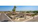 A charming two-story home featuring a well-manicured desert-style front yard and a two-car garage at 7709 W Hearn Rd, Peoria, AZ 85381