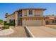 Attractive two-story home with a two-car garage and a landscaped front yard at 7709 W Hearn Rd, Peoria, AZ 85381
