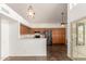 Bright, open kitchen with ample cabinet space and stainless steel appliances and stone floors at 7709 W Hearn Rd, Peoria, AZ 85381