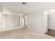 Second-floor loft area featuring carpet and white walls overlooking lower level at 7709 W Hearn Rd, Peoria, AZ 85381