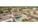 Aerial view of backyard features a refreshing pool, patio area, and well-maintained landscaping at 7709 W Hearn Rd, Peoria, AZ 85381