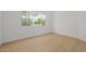 Bright and open bedroom features a modern window and wood-look floors at 7710 E Gainey Ranch E Rd # 115, Scottsdale, AZ 85258