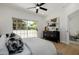 Relaxing primary bedroom boasts hardwood floors and a door to the outdoor patio at 7710 E Gainey Ranch E Rd # 115, Scottsdale, AZ 85258