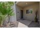 Inviting front entrance with a stylish door, and desert landscaping at 7710 E Gainey Ranch E Rd # 115, Scottsdale, AZ 85258