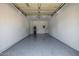 Clean garage with epoxy flooring, ready for parking and storage, offering a fresh and durable space at 7710 E Gainey Ranch E Rd # 115, Scottsdale, AZ 85258