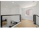 Second floor landing with minimalist black railing and modern design at 7710 E Gainey Ranch E Rd # 115, Scottsdale, AZ 85258