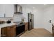 This contemporary kitchen features stainless steel appliances and stylish wood and white cabinetry at 7710 E Gainey Ranch E Rd # 115, Scottsdale, AZ 85258