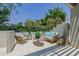 Comfortable patio seating area with lush greenery, creating a peaceful retreat for outdoor enjoyment at 7710 E Gainey Ranch E Rd # 115, Scottsdale, AZ 85258