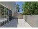 Open patio with tiled flooring and large sliding glass door offering a seamless transition to indoor living at 7710 E Gainey Ranch E Rd # 115, Scottsdale, AZ 85258