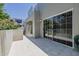 Spacious patio with sliding glass doors providing access to indoor living areas and outdoor relaxation at 7710 E Gainey Ranch E Rd # 115, Scottsdale, AZ 85258
