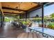 Covered patio with ping pong table, seating, and views of the pool at 7710 E Gainey Ranch E Rd # 115, Scottsdale, AZ 85258