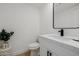 Elegant powder room featuring a modern black faucet and a marble countertop at 7710 E Gainey Ranch E Rd # 115, Scottsdale, AZ 85258