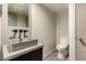 Bathroom features a modern sink, toilet, and vanity with modern fixtures at 8540 N Central Ave # 6, Phoenix, AZ 85020
