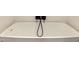 Close-up of a modern bathtub with a sleek faucet and unique tile design at 8540 N Central Ave # 6, Phoenix, AZ 85020