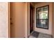 Front entryway featuring a sidelight window, doormat, and unit number at 8540 N Central Ave # 6, Phoenix, AZ 85020