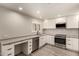 Bright updated kitchen with modern cabinets, stone countertops, and stainless steel appliances at 8540 N Central Ave # 6, Phoenix, AZ 85020