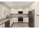 This bright kitchen features white cabinets, stainless steel appliances, and modern fixtures at 8540 N Central Ave # 6, Phoenix, AZ 85020