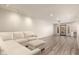Spacious living room featuring modern floors, recessed lighting, and a large sofa at 8540 N Central Ave # 6, Phoenix, AZ 85020