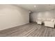 Open living room featuring modern flooring and a comfortable white sofa and ottoman at 8540 N Central Ave # 6, Phoenix, AZ 85020