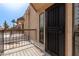 View from the balcony showcasing patio with security gate and privacy from neighbors at 8540 N Central Ave # 6, Phoenix, AZ 85020