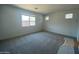 Spacious bedroom with neutral carpet and large windows offering plenty of natural light at 10217 W Fairmount Ave, Avondale, AZ 85392