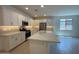Bright, modern kitchen with white cabinets, stainless steel appliances, and a large island at 10217 W Fairmount Ave, Avondale, AZ 85392