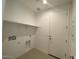 Functional laundry room with a shelf and hookups for a washer and dryer at 10217 W Fairmount Ave, Avondale, AZ 85392