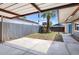Large covered backyard patio with wooden swing set and fence for outdoor living at 10951 N 91St Ave # 184, Peoria, AZ 85345