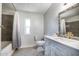 Beautifully updated bathroom featuring a stylish vanity, bathtub with shower, and herringbone tile flooring at 10951 N 91St Ave # 184, Peoria, AZ 85345