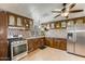 Well-equipped kitchen featuring ample cabinet space, modern appliances, and tile backsplash at 10951 N 91St Ave # 184, Peoria, AZ 85345