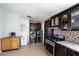 Additional kitchen view highlighting stainless steel appliances and convenient laundry area at 10951 N 91St Ave # 184, Peoria, AZ 85345