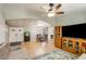 Open living area featuring tile flooring, double entry doors, and a glimpse into the dining area at 10951 N 91St Ave # 184, Peoria, AZ 85345