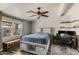 Bright main bedroom featuring a large window, modern décor, and wood-look flooring at 10951 N 91St Ave # 184, Peoria, AZ 85345