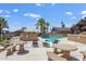 Inviting community pool area featuring ample seating, shade, and a well-maintained deck at 10951 N 91St Ave # 184, Peoria, AZ 85345